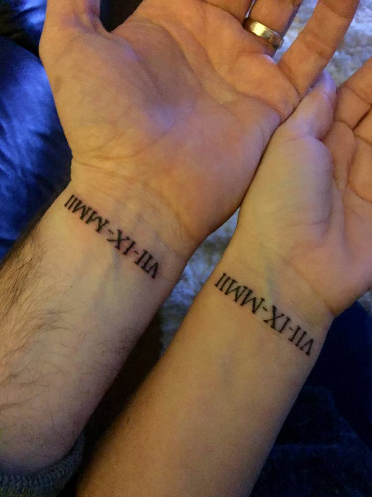 Matching Roman Numeral Date Tattoo On Wrists