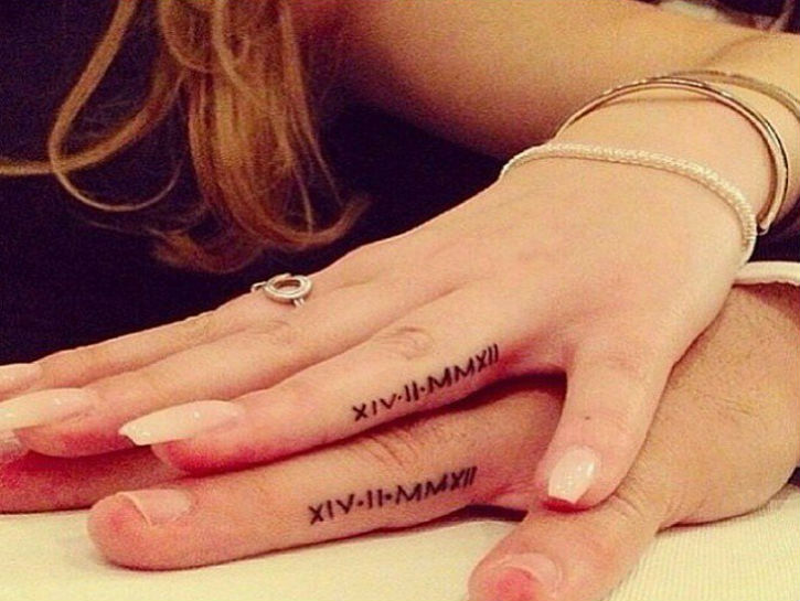 Matching Roman Numerals Tattoos On Fingers