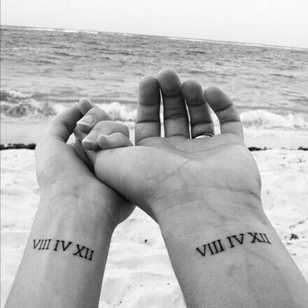 Nice Couple Roman Numerals Tattoos On Wrist