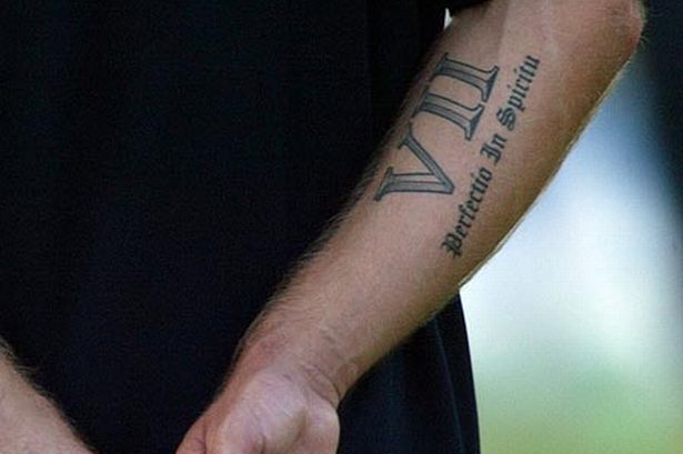 Nice Roman Numeral Seven With Lettering Tattoo On Arm Sleeve