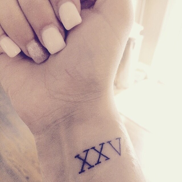 Nice Tiny Roman Numeral Tattoo On Wrist
