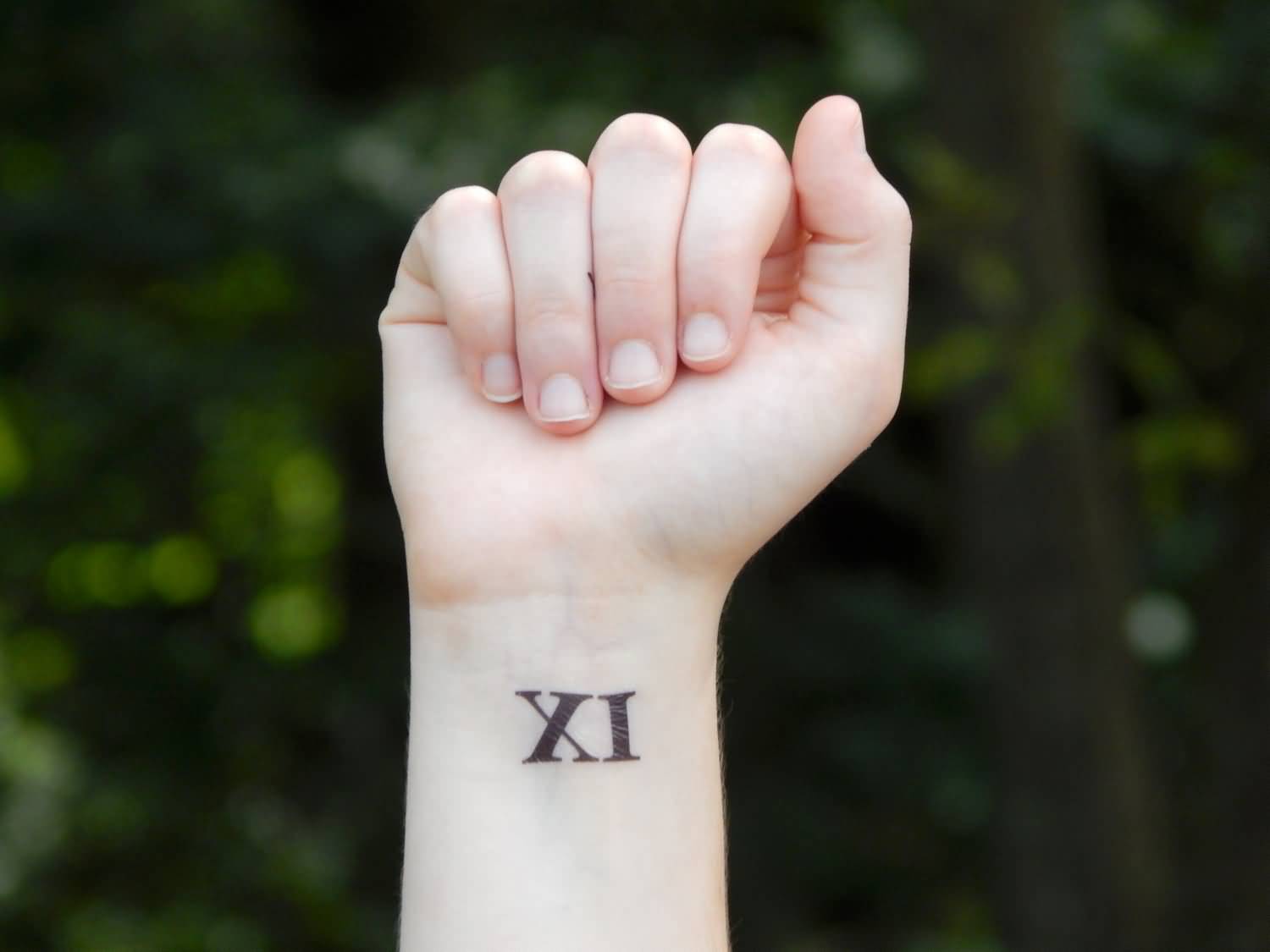 Roman Numeral Eleven Tattoo On Wrist