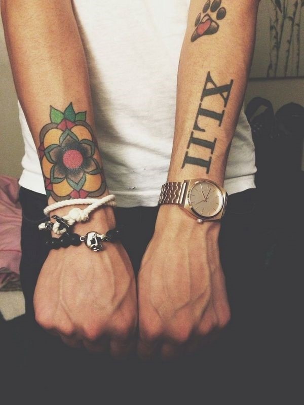 Roman Numeral With Traditional Flower Tattoo On Both Wrists