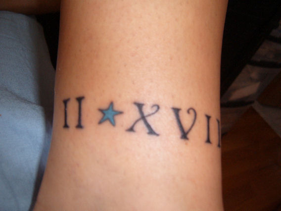 Roman Numerals With Blue Star Tattoo