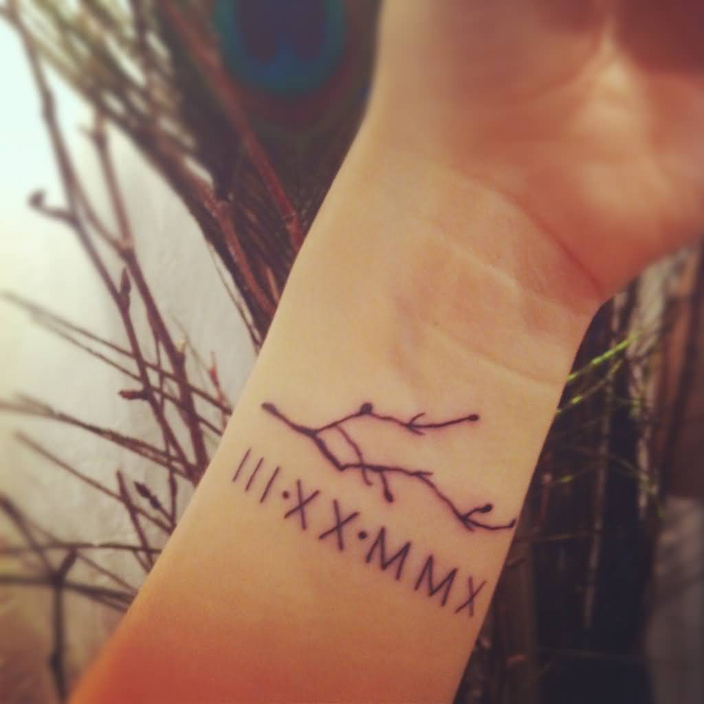 Roman Numerals With Tree Branches Tattoo On Wrist