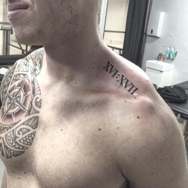 Short Roman Numeral Tattoo On Left Shoulder By Simon Diamant