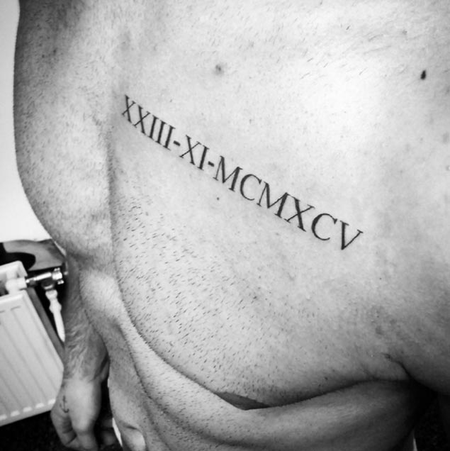 Simple Roman Numeral Tattoo On Chest By Amilcar