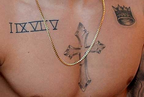 Simple Roman Numerals With Crown And Cross Tattoo On Chest