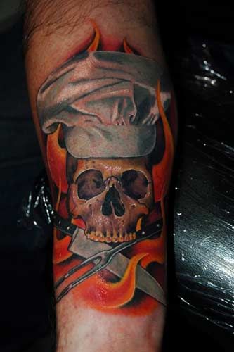 Skull With Chef Hat And Knives With Flames Tattoo On Forearm