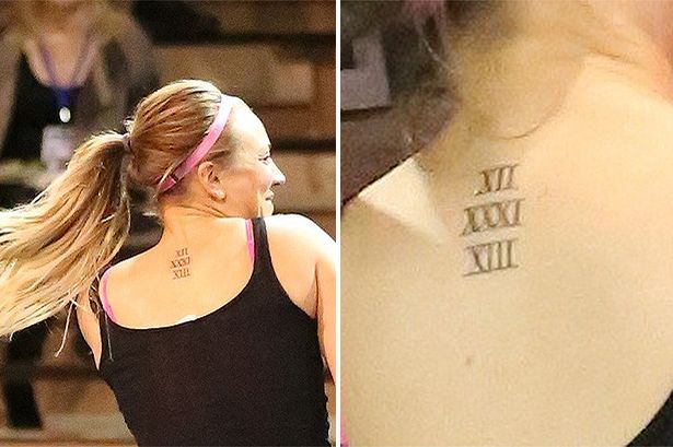 Small Roman Numerals Tattoo On Upper Back