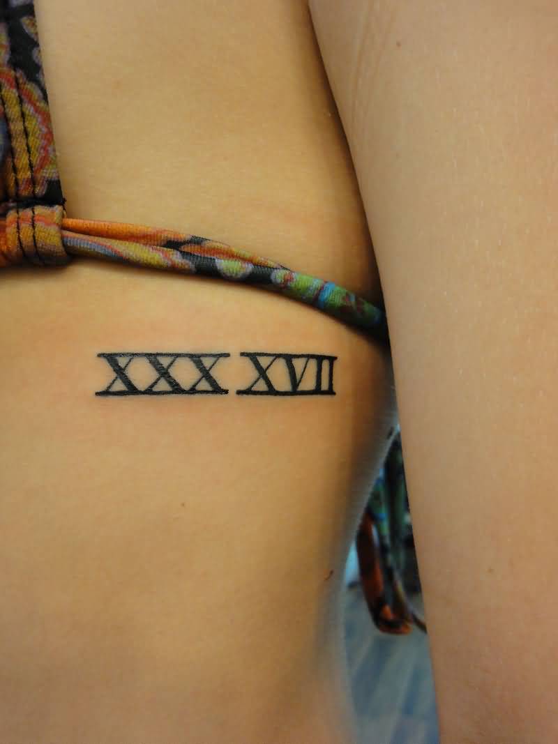 Superb Roman Numeral Tattoo On Side Rib