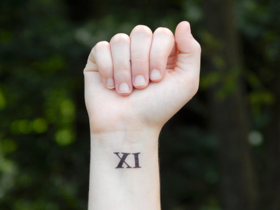 Sweet Roman Numeral Eleven Tattoo On Wrist