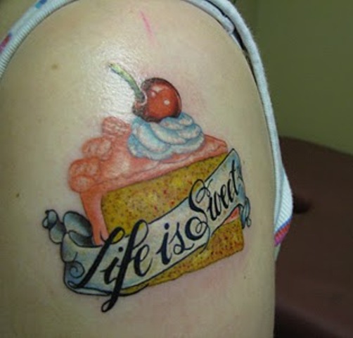 Traditional Pastry With Life Is Sweet Banner Tattoo On Half Sleeve