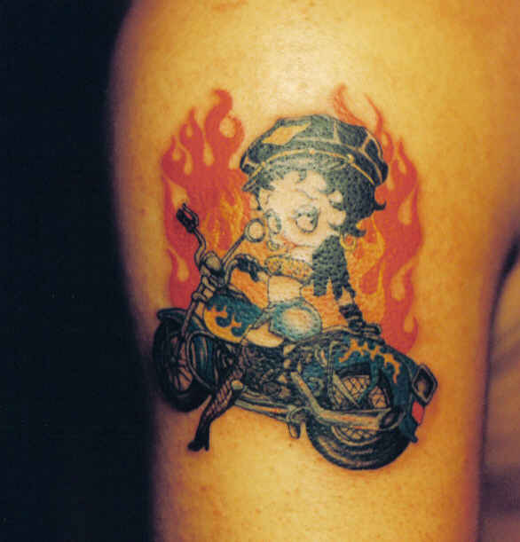 Tribal Flaming Biker Betty Boop Tattoo On Bicep