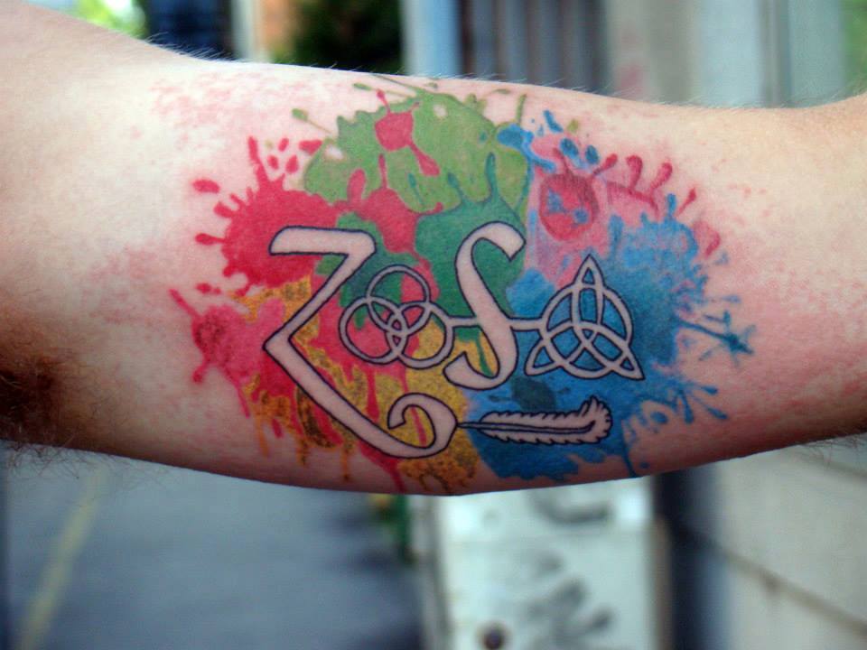 Watercolor Tattoo on Bicep by Marley Tattoo