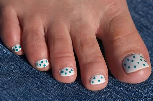 White Base Nails With Blue Polka Dots Nail Art For Toe