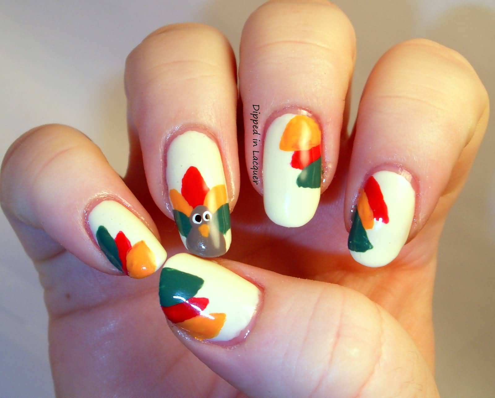 White Nails With Turkey Face And Leaves Thanksgiving Nail Art