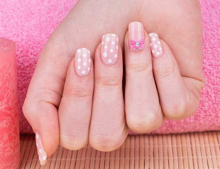 White Polka Dots Nail Art With Accent Bow Design