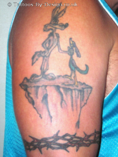 Wile E Coyote Tattoo On Right Shoulder