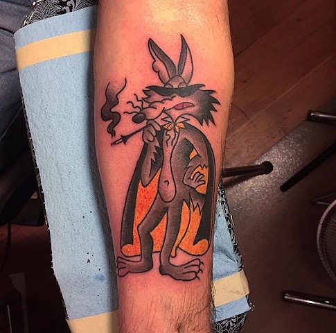 Wile E. Coyote Smoking Tattoo On Forearm