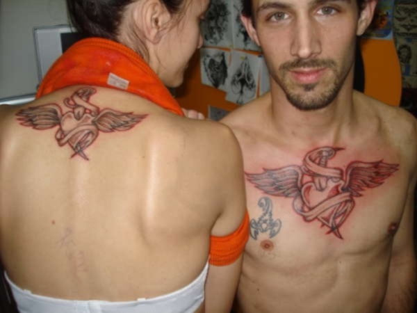 Adorable Winged Heart Couple Matching Tattoos On Chest And Nape