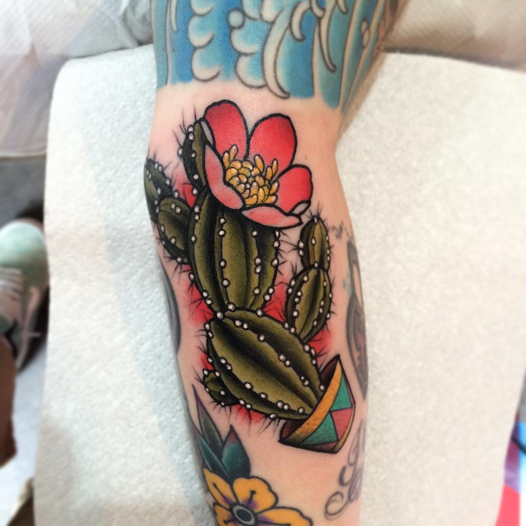 Amazing Cactus In Pot With Flowers Traditional Tattoo On Leg