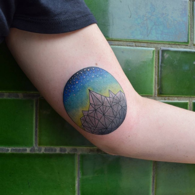 Amazing Colorful Geometric Mountains In Circle Tattoo On Bicep