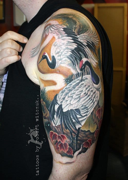 Amazing Crane Tattoo On Left Half Sleeve by Robert Witczuk