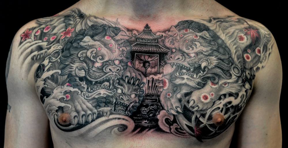 Amazing Foo Dogs Ripped Skin With Temple Tattoo On Chest
