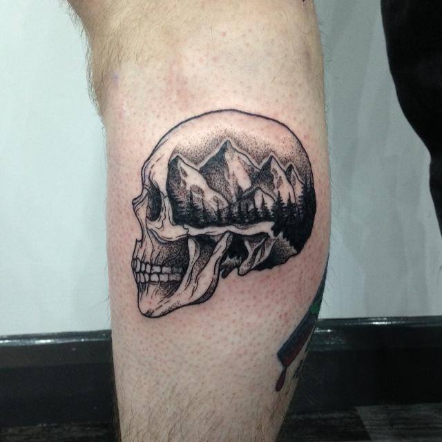 Amazing Mountains And Trees On Skull Tattoo On Leg
