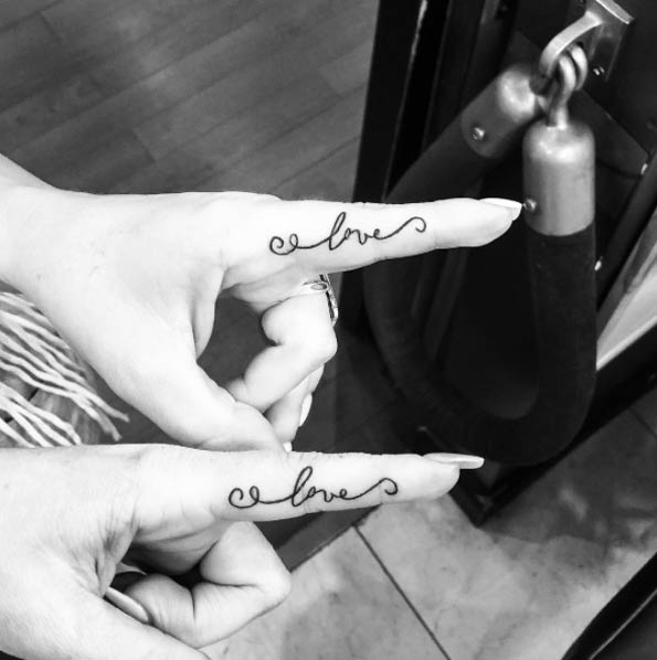 Beautiful Love Matching Couple Tattoos On Fingers By Channing