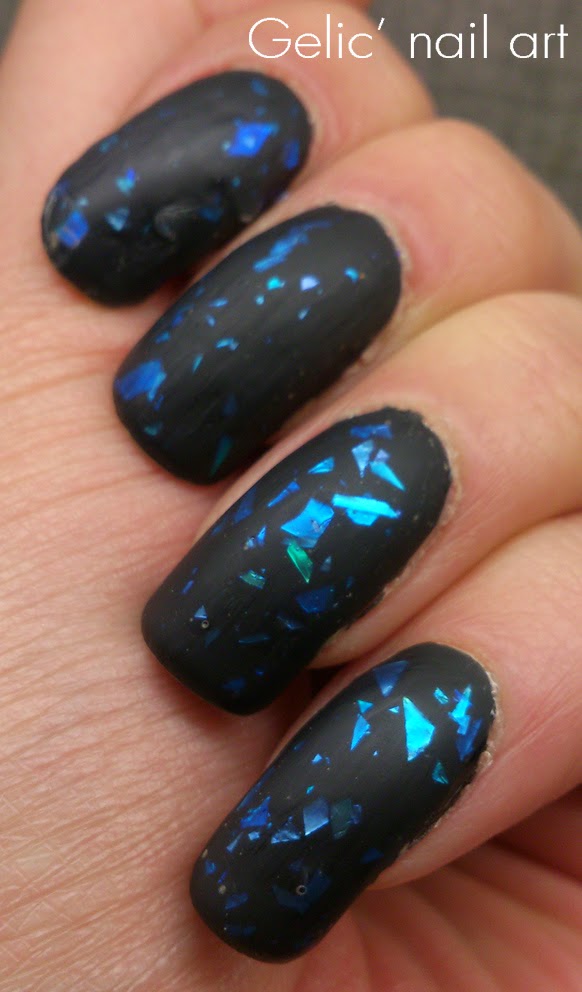 Beautiful Matte Black Nails With Blue Sprinkles Design Idea