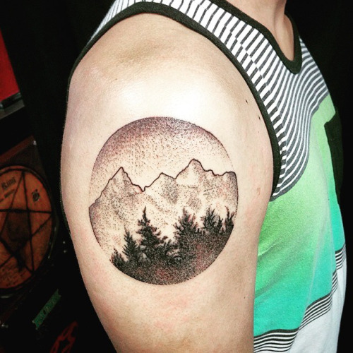 Black And Grey Mountains With Pine Trees In Circle Tattoo On Right Shoulder