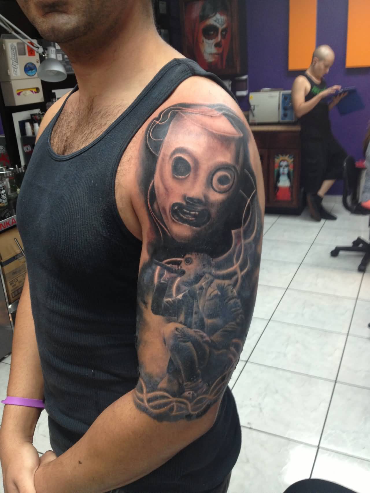 Black And Grey Realistic Slipknot Band Tattoo On Left Half Sleeve