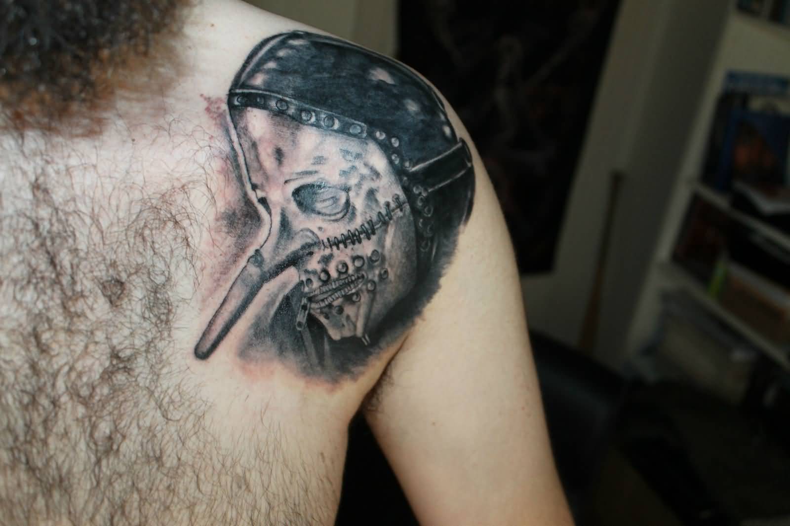 Black And Grey Slipknot Mask Tattoo On Left Upper Shoulder