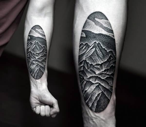 Black And White Mountains In Circle Tattoo On Forearm