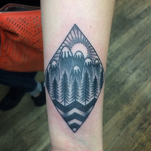 Black And White Mountains In Diamond Shape Traditional Tattoo On Forearm