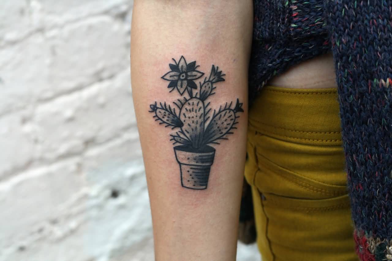 Black And White Small Traditional Cactus Flower Tattoo On Forearm.