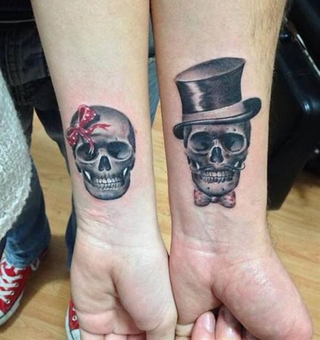 Black Color Couple Skulls Matching Tattoos On Wrists