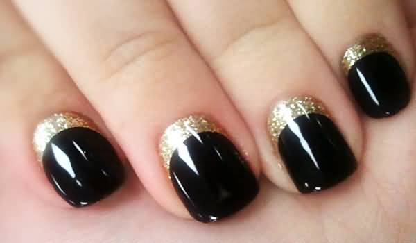 Black Glossy Nails With Gold Glitter Reverse French Tip Nail Art