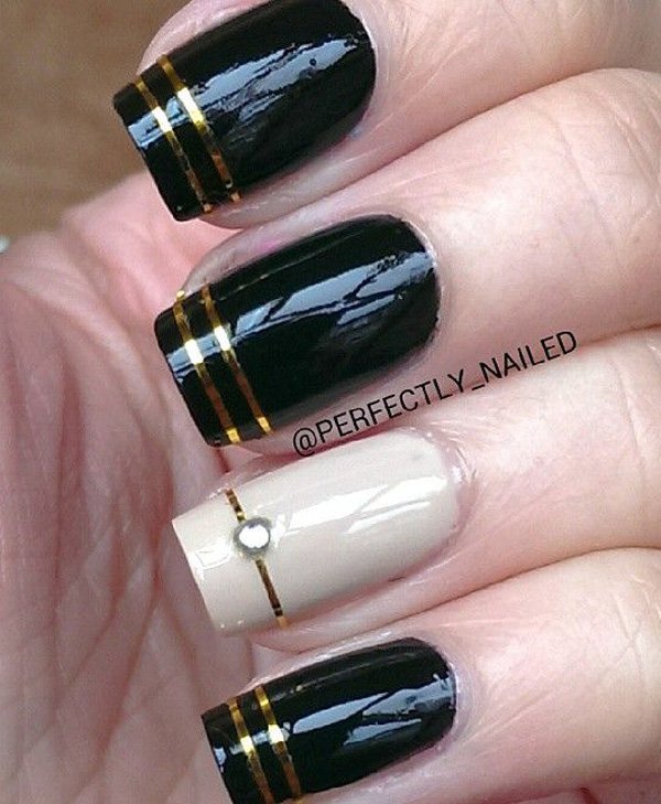 Black Glossy Nails With Gold Stripes Design Nail Art