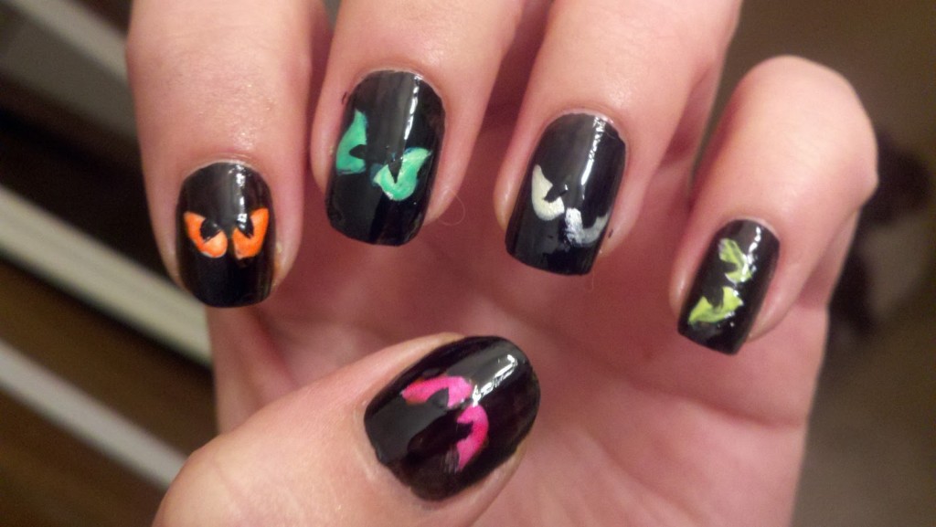 Black Nails With Scary Eyes Halloween Nail Art