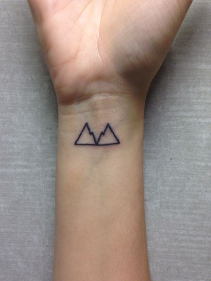 Black Small Mountain Outline Tattoo On Wrist