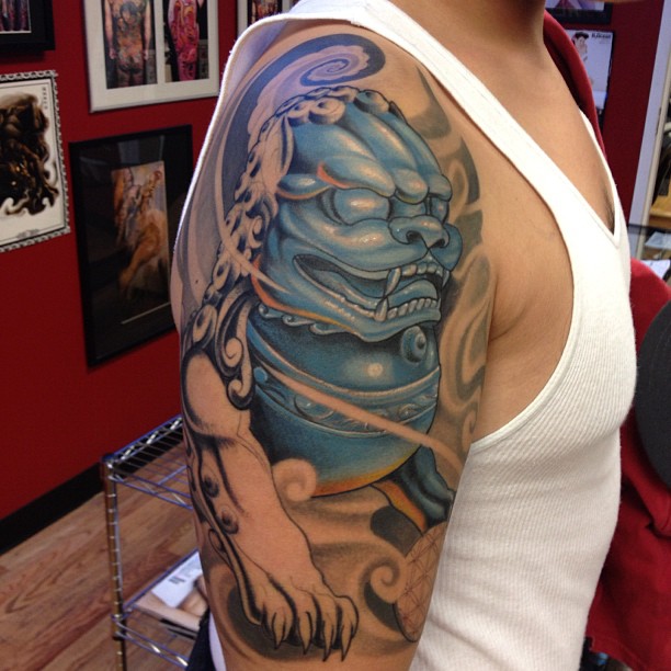 Blue And Grey Color Foo Dog Tattoo On Right Shoulder