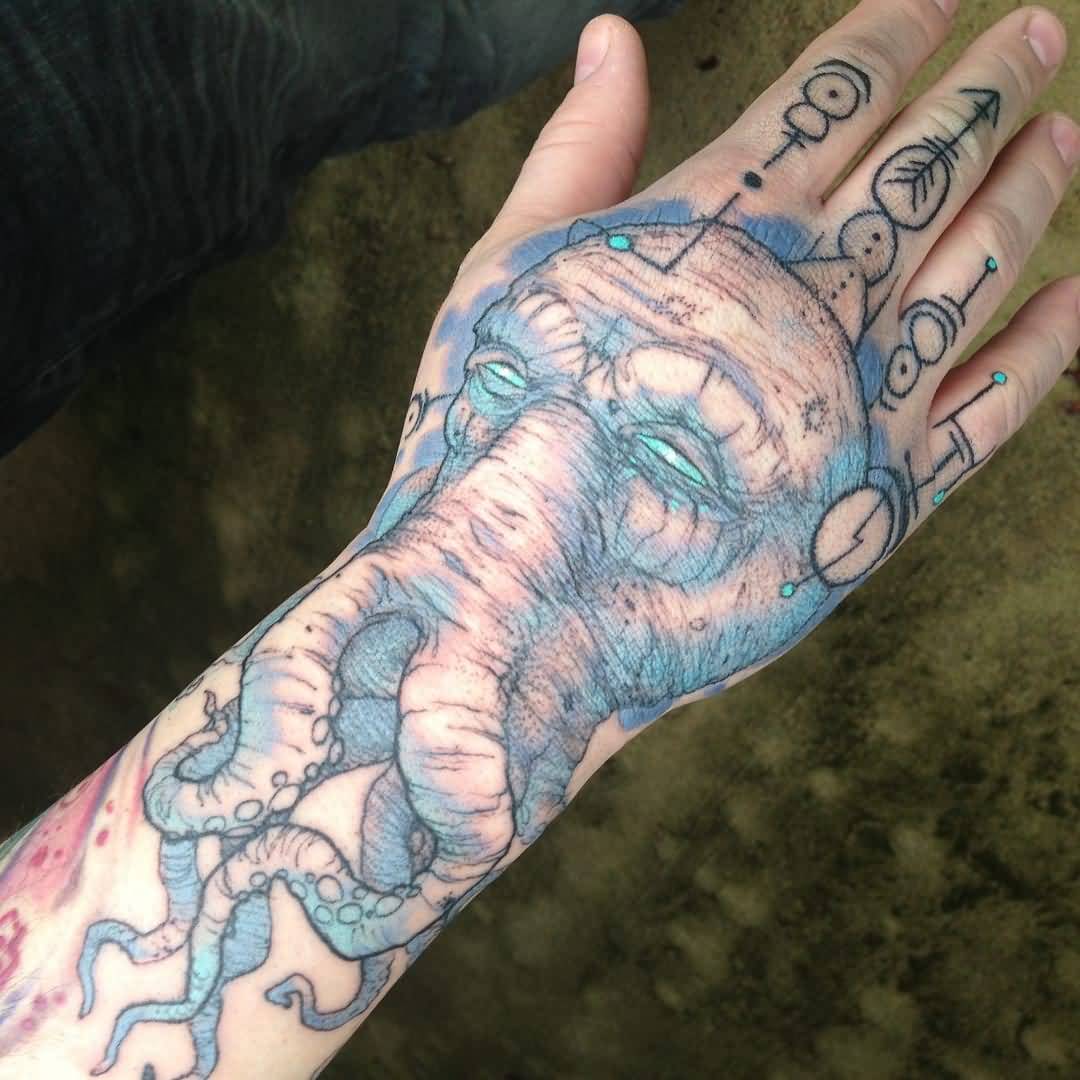 Blue Ink Cthulhu Tattoo On Hand by Joe King