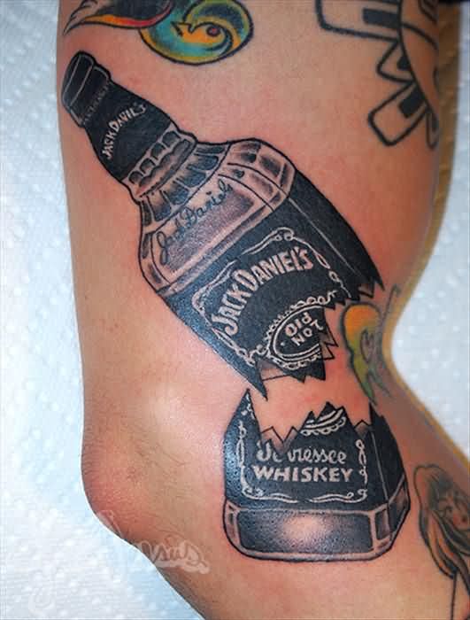 Broken Into Two Jack Daniels Bottle Tattoo On Sleeve