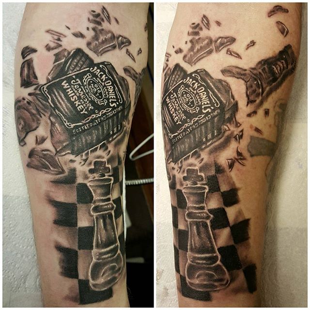 Broken Jack Daniel Bottle With Chess Board Tattoo On Sleeve