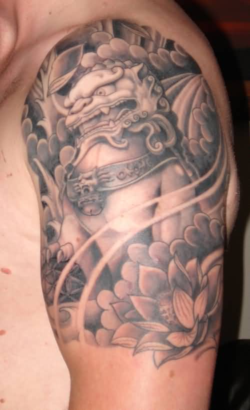 Chronic Colored Foo Dog With Leaves And Flowers Tattoo On Left Shoulder