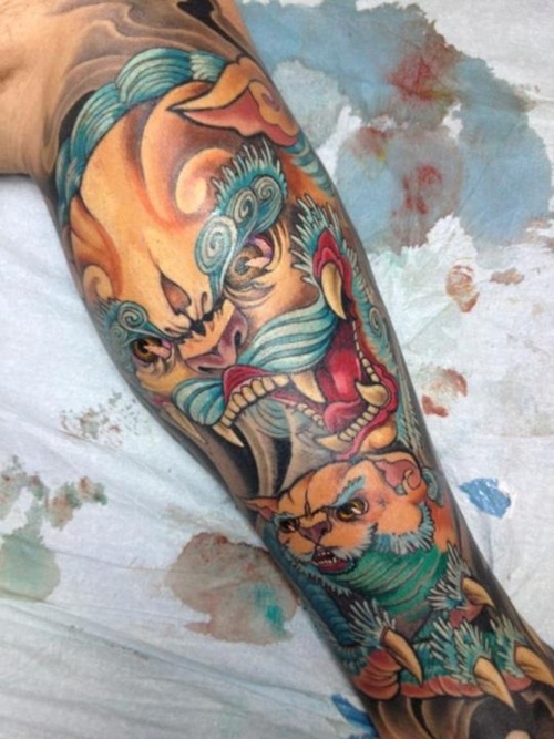Colorful Angry Foo Dog Tattoo On Leg