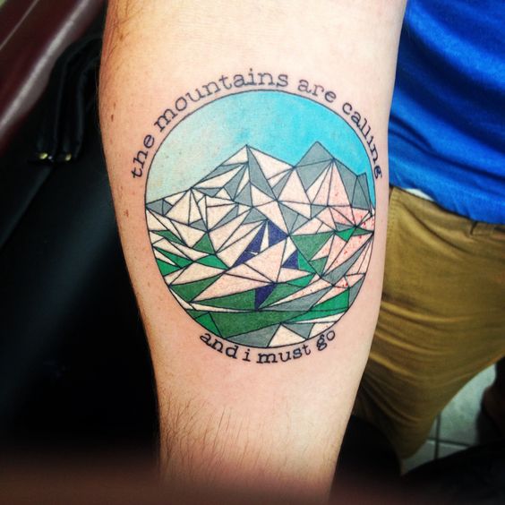 Colorful Geometric Mountains In Circle Tattoo On Forearm